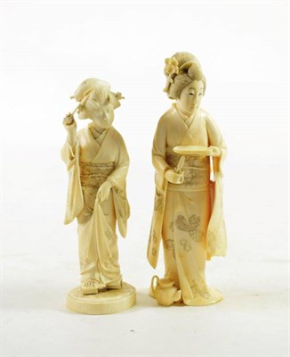 Lot 1464 - A Japanese Ivory Okimono, Meiji period, as a maiden carrying a tray and scissors, a teapot at...