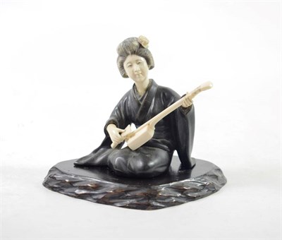 Lot 1474 - A Japanese Bronze and Ivory Figure of a Musician, early 20th century, the seated maiden playing...