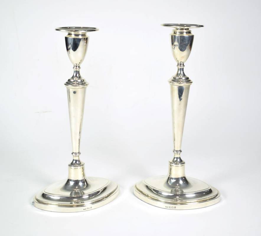 Lot 1481 - A Pair of Silver Candlesticks of George III Style, Thomas A Scott, Sheffield 1912, the plain...