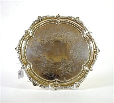 Lot 1508 - An Edwardian Silver Salver, Martin Hall & Co, Sheffield 1908, shaped circular with bead and foliate