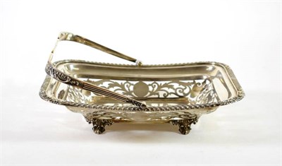 Lot 1510 - An Edwardian Silver Swing Handled Basket, Martin Hall & Co, Sheffield 1903, rounded rectangular...