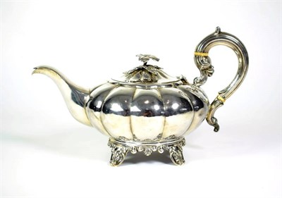 Lot 1518 - A William IV Silver Teapot, John & Henry Lias, London 1837, squat circular melon fluted form on...