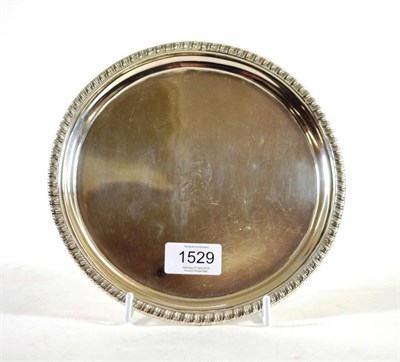 Lot 1529 - A George III Silver Small Salver, John Mewburn, London 1808, circular with gadroon border on...