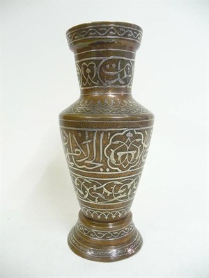 Lot 352 - A Persian Silver Inlaid Copper Vase, 19th century, of flared cylindrical form with sloping...