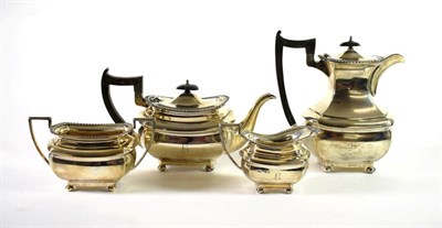 Lot 1536 - A Four Piece Silver Tea Service, Walker & Hall, Sheffield 1957, with gadroon rim and on four...