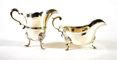 Lot 1542 - ~ An Edwardian Silver Cream Jug of 18th Century Style, Goldsmiths & Silversmiths, London 1903, with