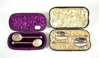 Lot 1551 - ~ A Pair of Victorian Silver Serving Spoons, Edward Hutton, London 1883, in a fitted case; and...