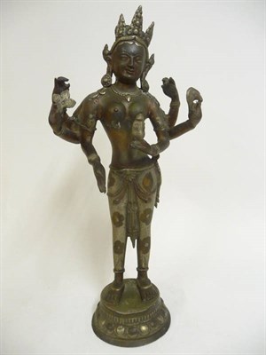 Lot 354 - An Indian Silvered Metal Figure of Ganga, 19th century, the standing goddess with foliate headdress