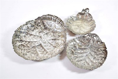 Lot 1580 - Three Persian Silver Leaf Dishes, all bearing tughra marks, 19th Century, chased and engraved...