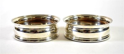 Lot 1594 - A Pair of George III Silver Wine Coasters, maker's mark rubbed, London 1808, plain with reeded...