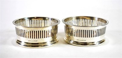 Lot 1595 - A Pair of George V Silver Wine Coasters, Asprey & Co, Birmingham 1915, with reeded rim and...