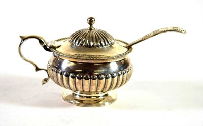 Lot 1606 - A George III Silver Mustard Pot and Spoon, maker's mark indistinct, London 1817, the King's pattern