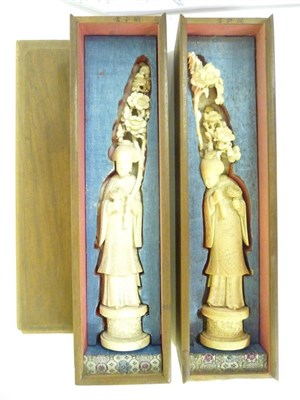 Lot 362 - A Pair of Chinese Ivory Figures, late 19th/early 20th century, as maidens in flowing robes carrying