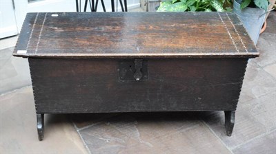 Lot 375 - ^ A 17th Century Oak Chest, of six plank construction, with a hinged and chip carved lid, enclosing