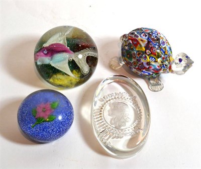 Lot 7 - A floral glass paperweight probably Baccarat (a.f.); a paperweight featuring a fish; another marked