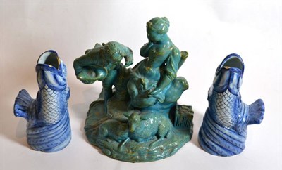 Lot 18 - A Sevres style turquoise glazed model of a shepherd and a shepherdess; and a pair of tin glazed...
