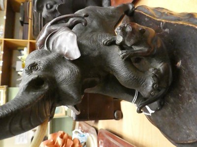 Lot 21 - A Japanese bronze elephant with tigers upon a wooden base