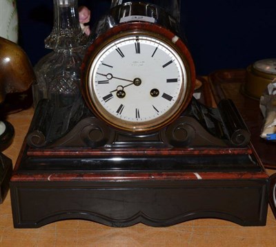Lot 32 - A black slate and red marble striking mantel clock, retailed by Roskel & Co, Liverpool