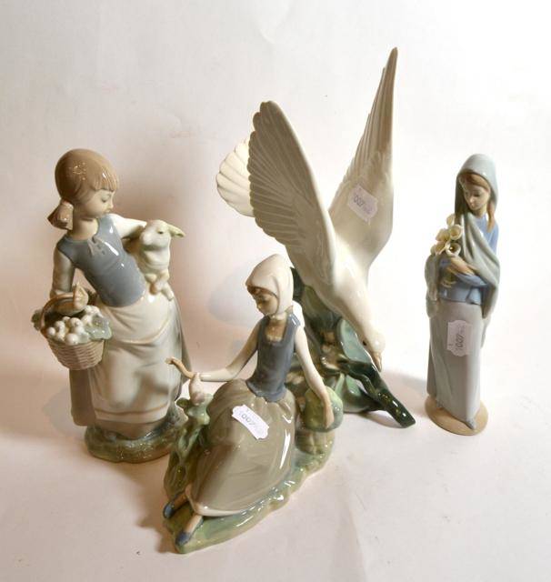 Lot 36 - Four Lladro china figures, three with original boxes