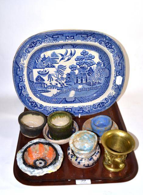 Lot 39 - A blue and white Old Willow pattern platter, eight art pottery bowls and a bronze mortar