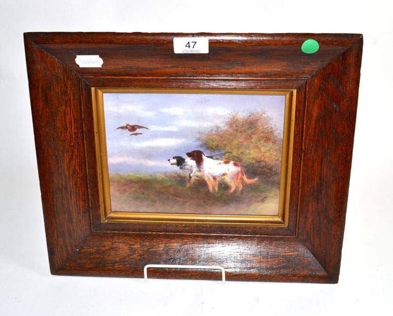 Lot 47 - A Crown Devon Fieldings painted porcelain plaque depicting gundogs and game, signed R Hinton, circa