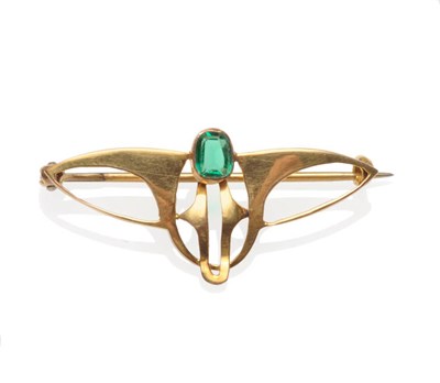 Lot 371 - An Art Nouveau Brooch, the stylised wing form set with a green paste, measures 3.7cm by 1.8cm,...