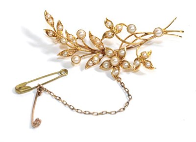 Lot 52 - A pearl set flower brooch, stamped '15CT', length 6cm