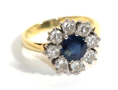 Lot 81 - An 18 carat gold sapphire and diamond cluster ring, finger size K1/2