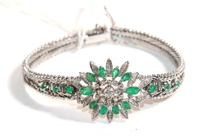 Lot 82 - An emerald and diamond bracelet, a lozenge shaped panel comprised of round brilliant cut and...