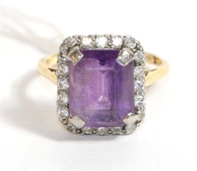 Lot 107 - An amethyst and diamond cluster ring, stamped '18CT'