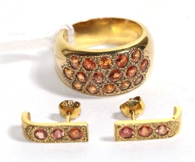 Lot 113 - An orange sapphire ring, stamped '9K, finger size S1/2; and orange sapphire earrings, with post...