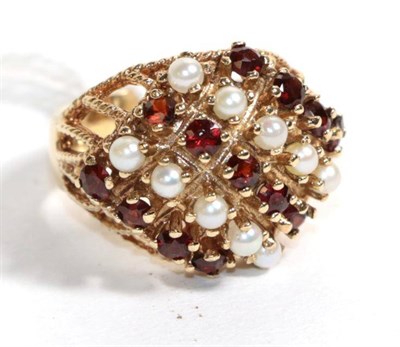 Lot 116 - A 9 carat gold ruby and seed pearl set ring, finger size O