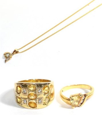 Lot 124 - A yellow and white sapphire pendant on chain, chain stamped '750'; and two yellow and white...