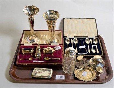 Lot 138 - A cased silver salt and pepper; cased silver tea spoons and sugar tong; two silver spill vases;...