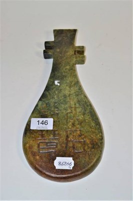 Lot 146 - A Chinese carved spinach jade stringed instrument, 20th century four character marks, 31.5cm long