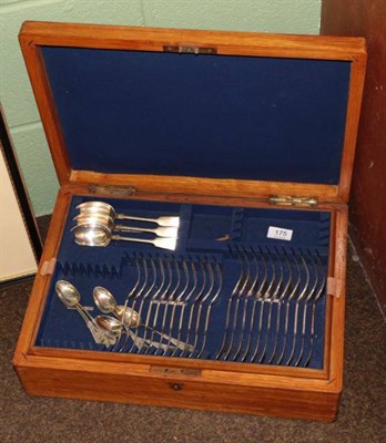 Lot 175 - An oak canteen containing a part suite of plated fiddle pattern cutlery