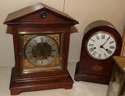 Lot 179 - An oak cased striking mantel clock and a mahogany cased striking inlaid mantel clock (2)