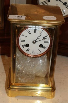 Lot 180 - A small four glass mantel clock