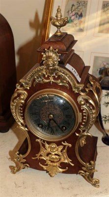 Lot 181 - A gilt metal mounted striking mantel clock