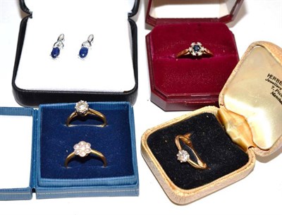 Lot 188 - Four gem set dress rings, stamped '18CT', finger sizes M, M, M and Q; and a pair of sapphire...