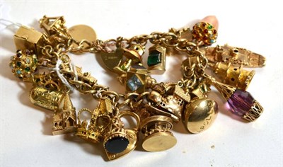 Lot 191 - A 9 carat gold charm bracelet with twenty eight charms