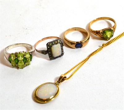 Lot 198 - An opal pendant, chain length 46cm; a peridot ring, stamped '925', finger size N; an opal and paste