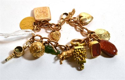 Lot 200 - A charm bracelet, chain links stamped '9C'; together with Continental charms attached