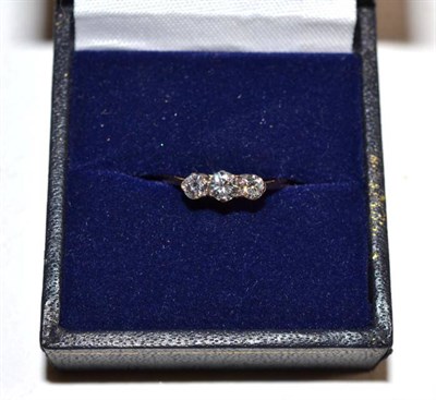 Lot 205 - A three stone diamond ring, stamped '18CT', finger size K