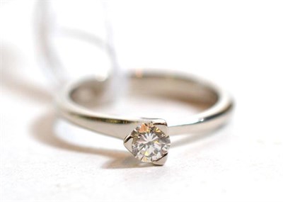 Lot 233 - A platinum solitaire diamond ring, a round brilliant cut diamond in a claw setting, to...