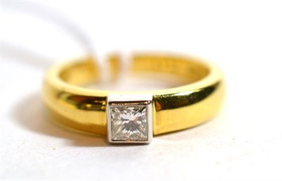 Lot 235 - An 18 carat gold solitaire princess cut diamond ring, in a white rubbed over setting, estimated...