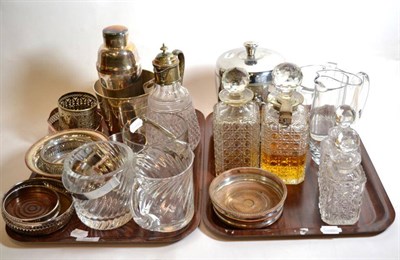 Lot 246 - Two trays of plated and glass wares including decanters, one with a Betjemann's patent lock, bottle