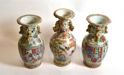 Lot 262 - A pair of Chinese famille rose vases; and a similar example (3)