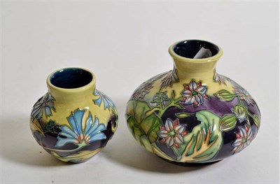 Lot 267 - Modern Moorcroft pottery: a 'Chicory' pattern vase 9cm high, together with a further squat baluster