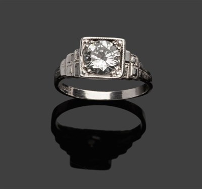 Lot 393 - An Art Deco Diamond Solitaire Ring, a round brilliant cut diamond in a white squared millegrain...